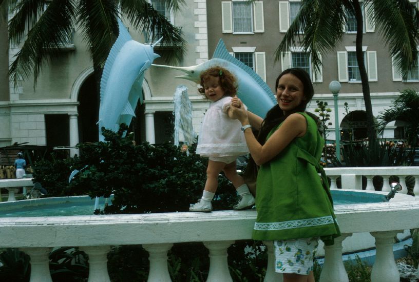  as she walks around fountain in   Nassau, Bahamas